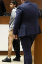 Former Marjory Stoneman Douglas High School student Anthony Borges, who was injured in the 2018 shootings, shows the scars from his injuries while testifying during the trial of former Marjory Stoneman Douglas High School School Resource Officer Scot Peterson, Thursday, June 8, 2023, at the Broward County Courthouse in Fort Lauderdale, Fla. Peterson is charged with child neglect and other charges for failing to stop the Parkland school massacre five years ago. (Amy Beth Bennett/South Florida Sun-Sentinel via AP, Pool)