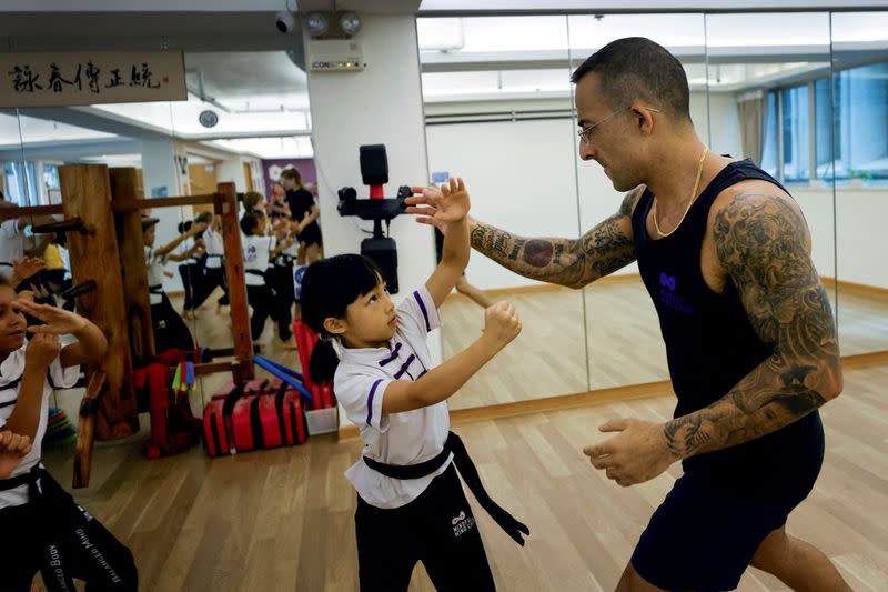 The Wider Image: Fifty years on, Bruce Lee's legacy squares up to modern life in Hong Kong