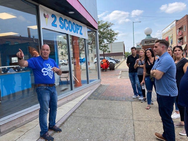 Tour participants get personalized service and a chat with 2 Scoopz owner David Beck as part of a Explore City Tour in Canton.