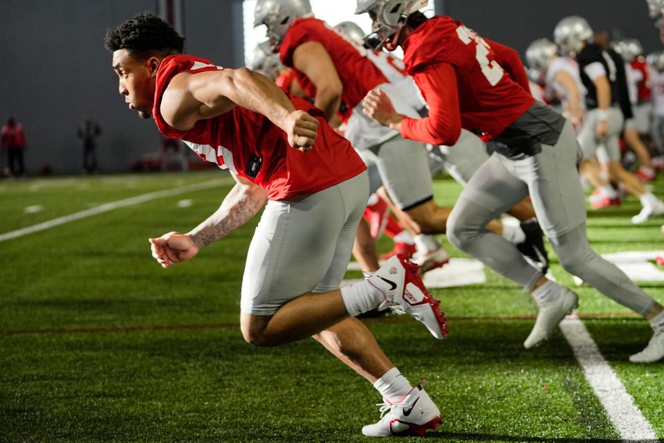 Mar 9, 2023; Columbus, Ohio, USA;  Ohio State Buckeyes running back TreVeyon Henderson (32) runs during spring football practice at the Woody Hayes Athletic Center. Mandatory Credit: Adam Cairns-The Columbus Dispatch