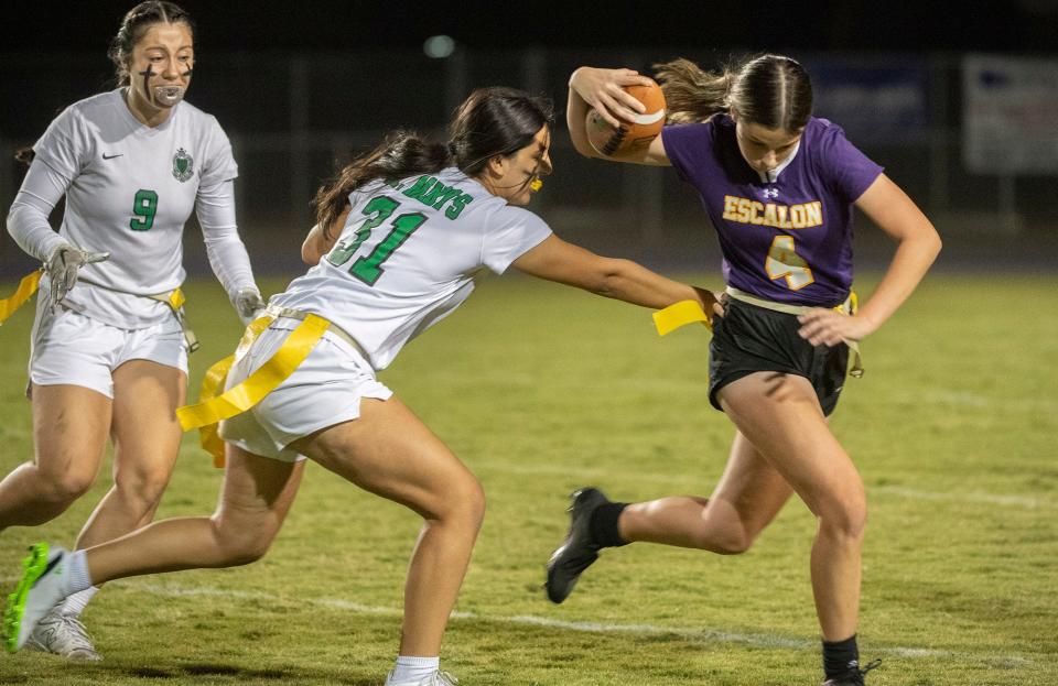 Escalon's Rayah McNulty, right, tries to get a way from St.Mary's Ava Gonzalez during the Sac-Joaquin Section Div. 2 semifinal at Escalon's Engel Field on Nov. 1, 2023. St. Mary's won 12-6.
