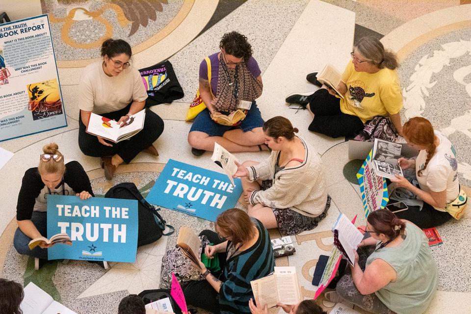 Protesters read in the middle of the Texas Capitol rotunda as The Texas Freedom Network holds a "read-in" on April 19, 2023. The bill would ban sexually explicit materials from library books in schools.