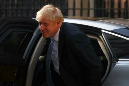 Britain's Prime Minister Boris Johnson arrives at Downing Street, in London