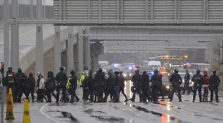 A group of Black Lives Matter protesters shut down the main road to the Minneapolis St. Paul Airport after a protest at the Mall of America in Bloomington, Minnesota December 23, 2015. REUTERS/Craig Lassig