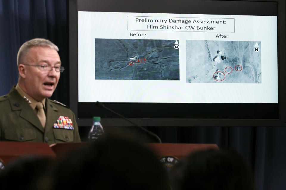 <p>Marine Lt. Gen. Kenneth F. McKenzie Jr., director, Joint Staff, speaks as he shows photographs from before and after the U.S.-led airstrikes against Syria during a media availability at the Pentagon, Saturday, April 14, 2018, in Washington. (Photo: Alex Brandon/AP) </p>