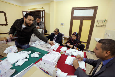 Officials count ballots on the final day of the referendum on draft constitutional amendments, in Cairo, Egypt April 22, 2019. REUTERS/Mohamed Abd El Ghany