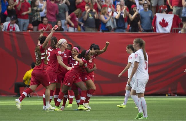 Team Canada celebrates its 1-0 win over Switzerland following the second half of FIFA Women&#39;s World Cup round of 16 soccer action in Vancouver, B.C., on June 21, 2015. Moving deeper into the Women&#39;s World Cup means more prize money for Canada.In qualifying for the quarter-finals with a 1-0 win over Switzerland on Sunday, the Canadians assured themselves at least US$725,000. The Swiss, as one of the teams placing ninth to 16th, go home with $500,000. THE CANADIAN PRESS/Jonathan Hayward