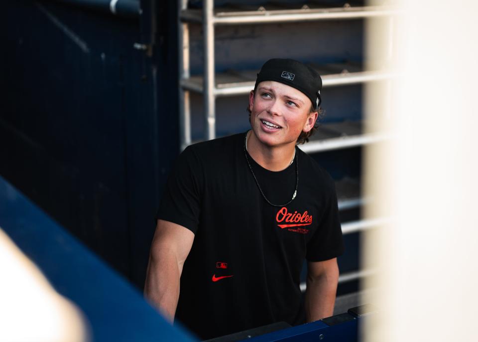 Jackson Holliday talks to fans before the Norfolk Tides' game against the WooSox on May 24.