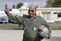 Indian Defense Minister Rajnath Singh gestures before a test flight in a Rafale jet fighter at the Dassault Aviation plant in Merignac, near Bordeaux, southwestern France, Tuesday, Oct. 8, 2019. France has delivered to India its first Rafale fighter jet from a series of 36 aircraft purchased in a multi-billion dollar deal in 2016. (AP Photo/Bob Edme)
