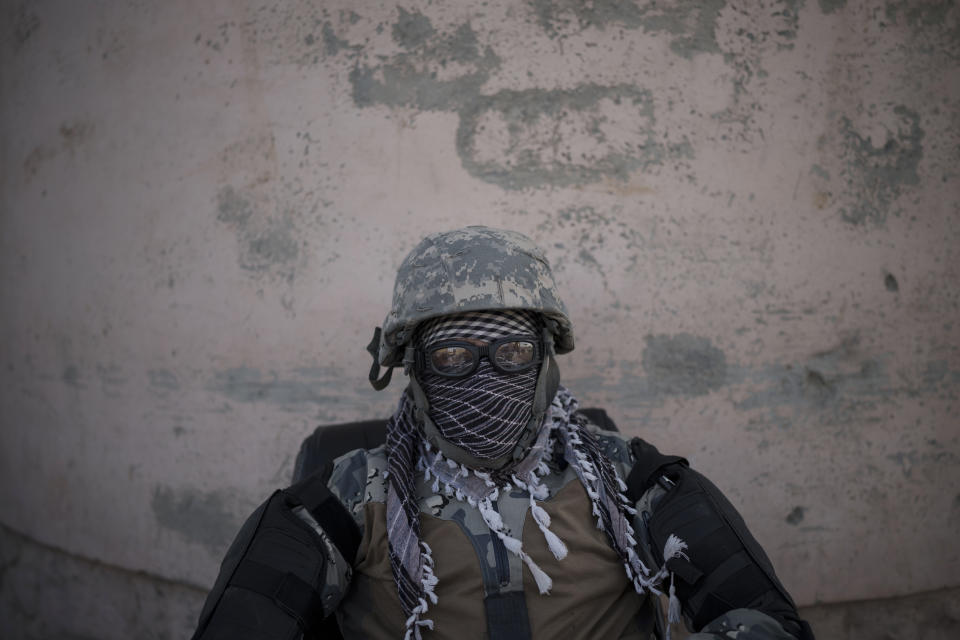 A Taliban fighter guards the entrance of the Pul-e-Charkhi prison in Kabul, Afghanistan, Monday, Sept. 13, 2021. Pul-e-Charkhi was previously the main government prison for holding captured Taliban and was long notorious for abuses, poor conditions and severe overcrowding with thousands of prisoners. Now after their takeover of the country, the Taliban control it and are getting it back up and running, current holding around 60 people, mainly drug addicts and accused criminals. (AP Photo/Felipe Dana)