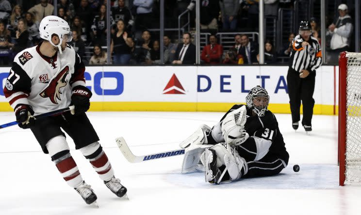 Arizona Coyotes defenseman Anthony DeAngelo (77) scores against Los Angeles Kings goalie Ben Bishop (31) during the shoot out of an NHL hockey game in Los Angeles, Tuesday, March 14, 2017. The Coyotes won 3-2, in a shoot out. (AP Photo/Alex Gallardo)