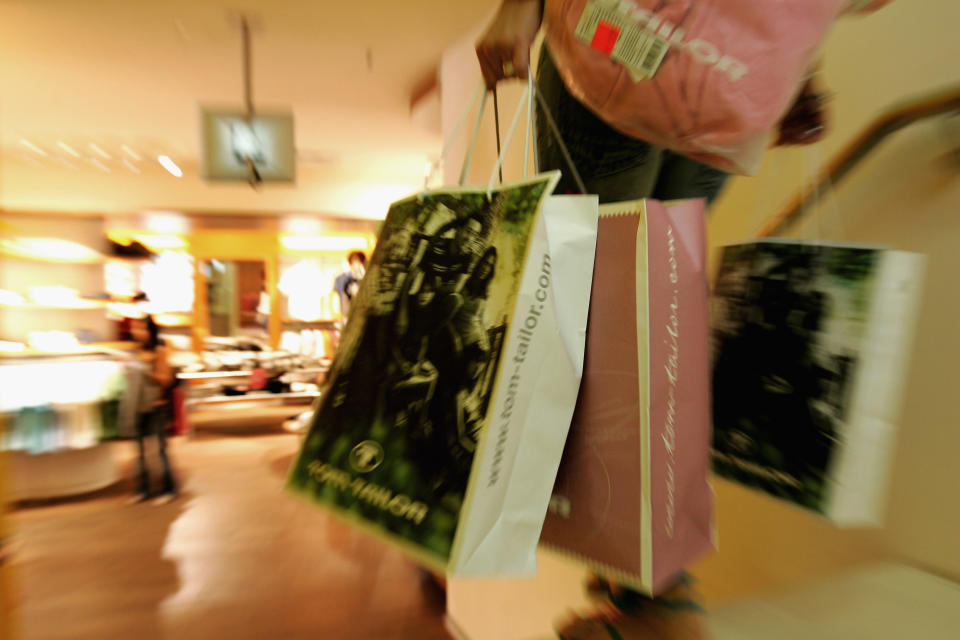 HAMBURG, GERMANY - JULY 28:  A woman leaves with full shopping bags at a department store on July 28, 2005 in Hamburg,Germany. The Summer Sales started on July 25 and many shops are offering discounts of up to 70 per cent. Sparked by the election manifesto of the opposition party CDU, Germany currently debates wether raising the Mehrwertsteuer (VAT) would in fact promote economic growth or if it would have the opposite effect by hurting families and low-income households.   (Photo Illustration by Andreas Rentz/Getty Images)