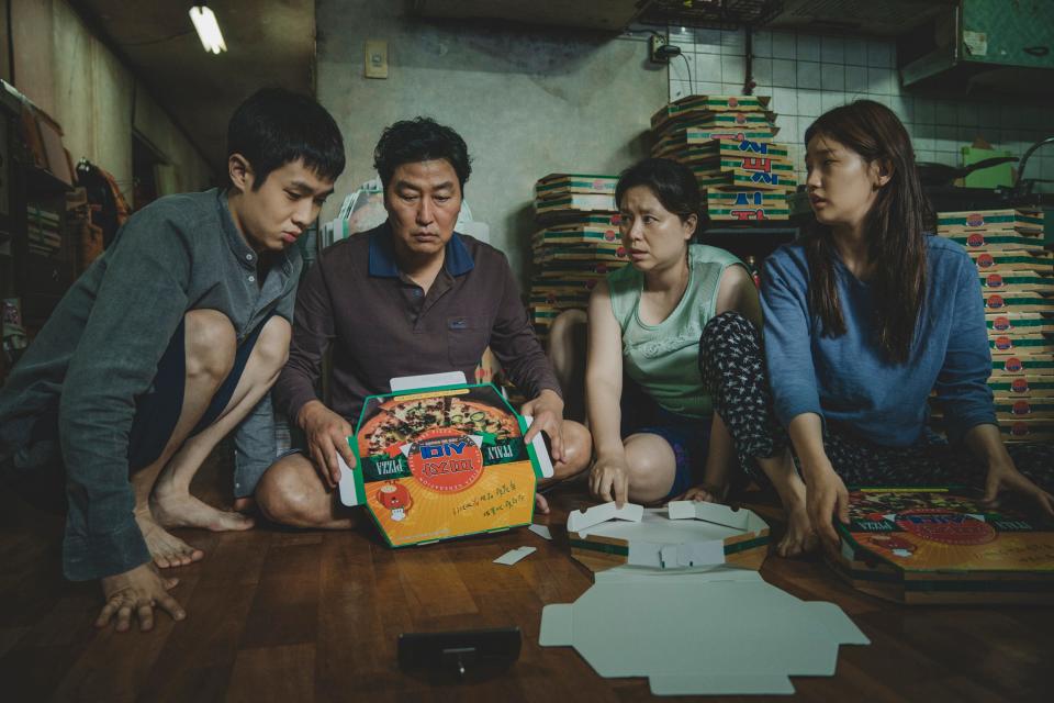 Choi Woo-shik, left, Song Kang-ho, Jang Hye-jin and Park So-dam star as a scheming South Korean family in the black comedy "Parasite."