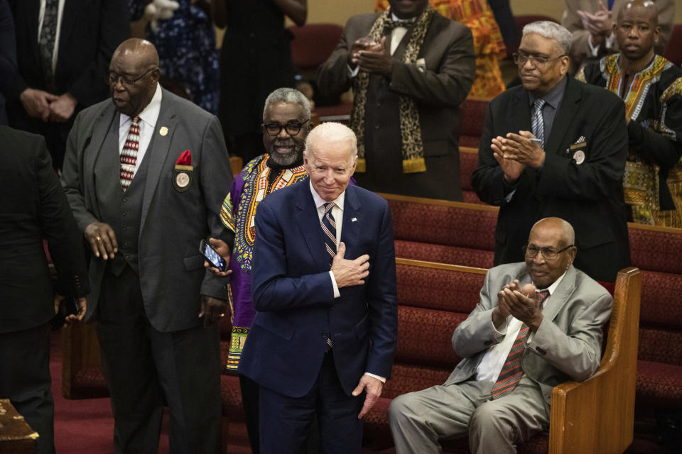 FILE - In this Sunday, Feb. 23, 2020, file photo, Democratic presidential candidate and former Vice President Joe Biden acknowledges applause from parishioners as he departs after attending services at the Royal Missionary Baptist Church in North Charleston, S.C. Democrats are betting on Biden’s evident comfort with faith as a powerful point of contrast in his battle against President Donald Trump. (AP Photo/Matt Rourke, File)