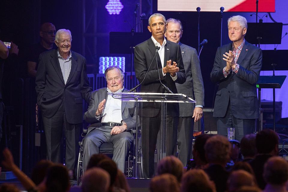 Former United States Presidents Jimmy Carter, George H.W. Bush, Barack Obama, George W. Bush, and Bill Clinton address the audience during the 'Deep from the Heart: The One America Appeal Concert' at Reed Arena on the campus of Texas A&M University on October 21, 2017 in College Station, Texas.