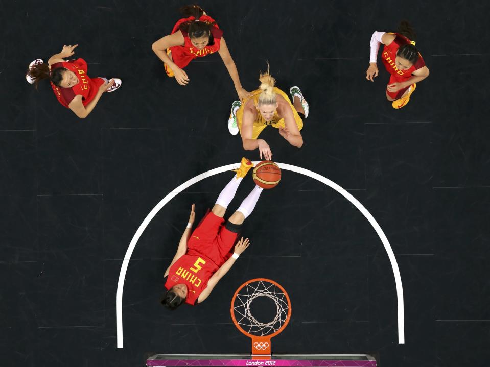 Australia's Lauren Jackson (15) shoots over China's Xiaoyun Song (5) in the women's quarterfinal basketball match at the Basketball Arena in London during the London 2012 Olympic Games August 7, 2012. REUTERS/Mike Segar (BRITAIN - Tags: OLYMPICS SPORT BASKETBALL TPX IMAGES OF THE DAY)