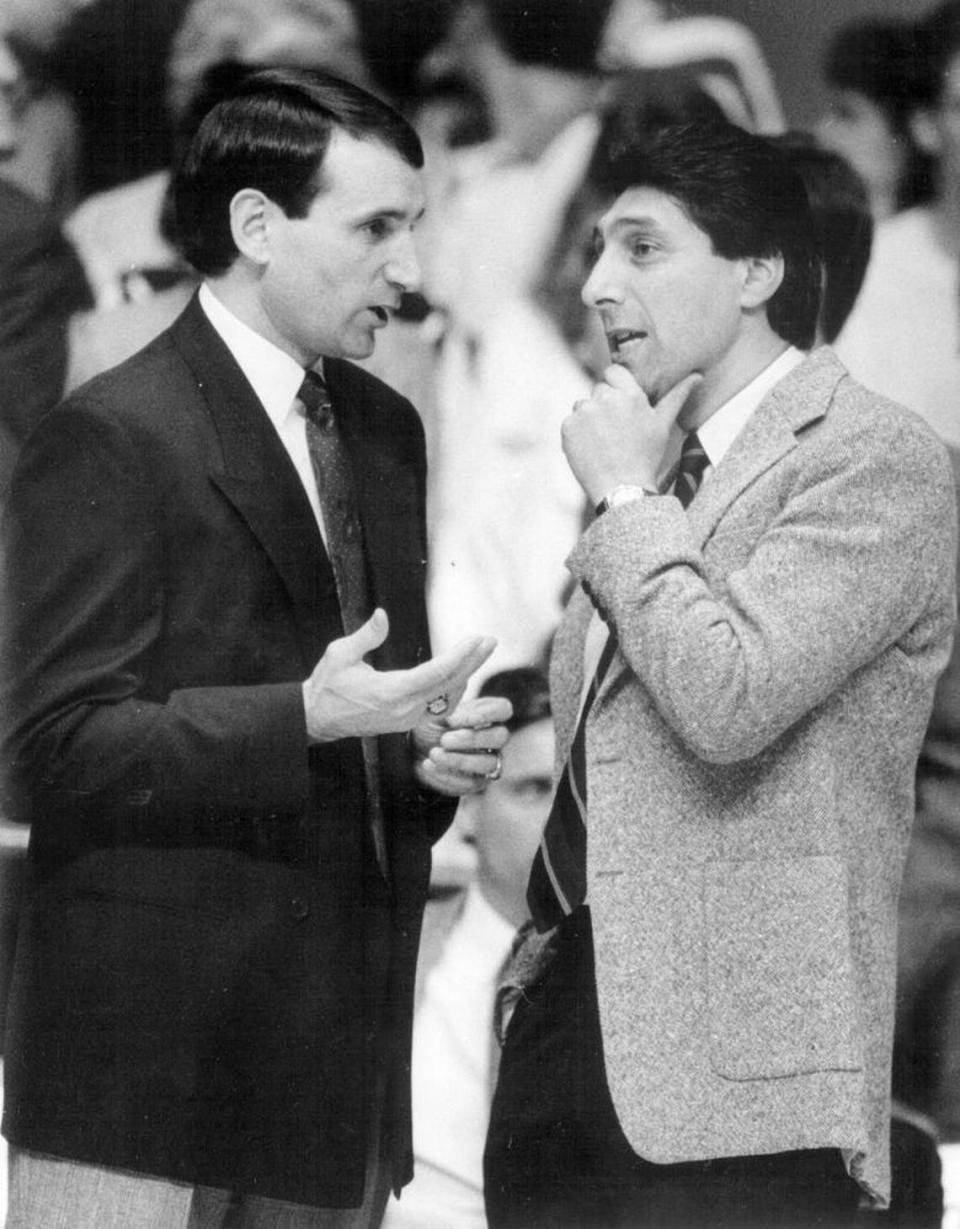 Duke coach Mike Krzyzewski talks with Jim Valvano before a game in January 1989 in Raleigh. Chris Seward/News & Observer File Photo