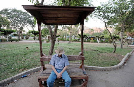 An Iraqi refugee and former interpreter for the U.S. Army in Iraq sits in a garden on the outskirts of Cairo, Egypt August 8, 2018. REUTERS/Staff