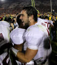 Quarterback Andrew Luck #12 of the Stanford Cardinal celebrates with teammates after the game with the USC Trojans at the Los Angeles Memorial Coliseum on October 29, 2011 in Los Angeles, California. Stanford won 56-48 in three overtimes. (Photo by Stephen Dunn/Getty Images)