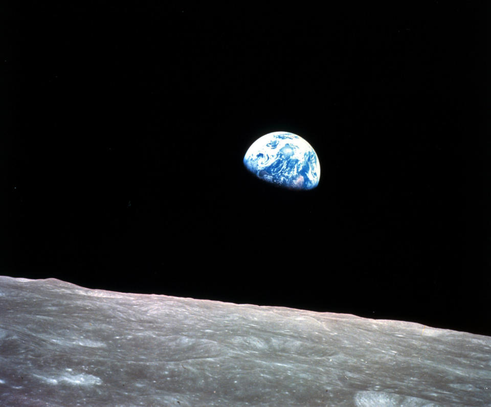 FILE - This photo made available by NASA shows the Earth behind the surface of the moon during the Apollo 8 mission, Dec. 24, 1968. The National Transportation Safety Board has released its preliminary investigation into the fatal plane crash of former astronaut William Anders. (William Anders/NASA via AP, File)