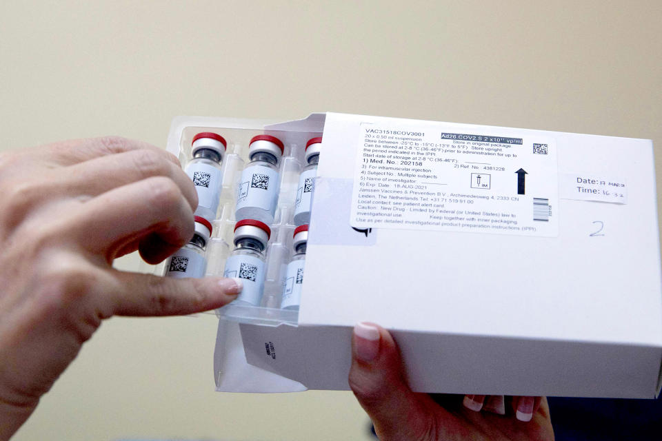 Image: A healthcare worker holds vials containing doses of the Johnson Johnson vaccine against the Covid-19 coronavirus as South Africa proceeds with its inoculation campaign at the Klerksdorp Hospital on Feb. 18, 2021. (Phill Magakoe / AFP - Getty Images)