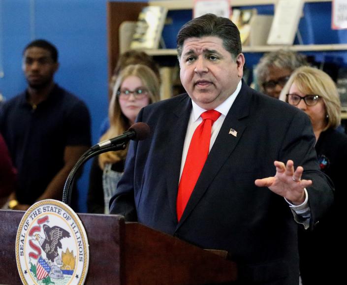 Illinois Gov. JB Pritzker answers questions after signing a package of four bills addressing the Illinois teachers shortages at Springfield High School Wednesday April 27, 2022. [Thomas J. Turney/ The State Journal-Register]