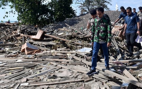 Indonesian President Joko Widodo vists the area affected by an earthqquake and tsunami in Palu - Credit: Reuters