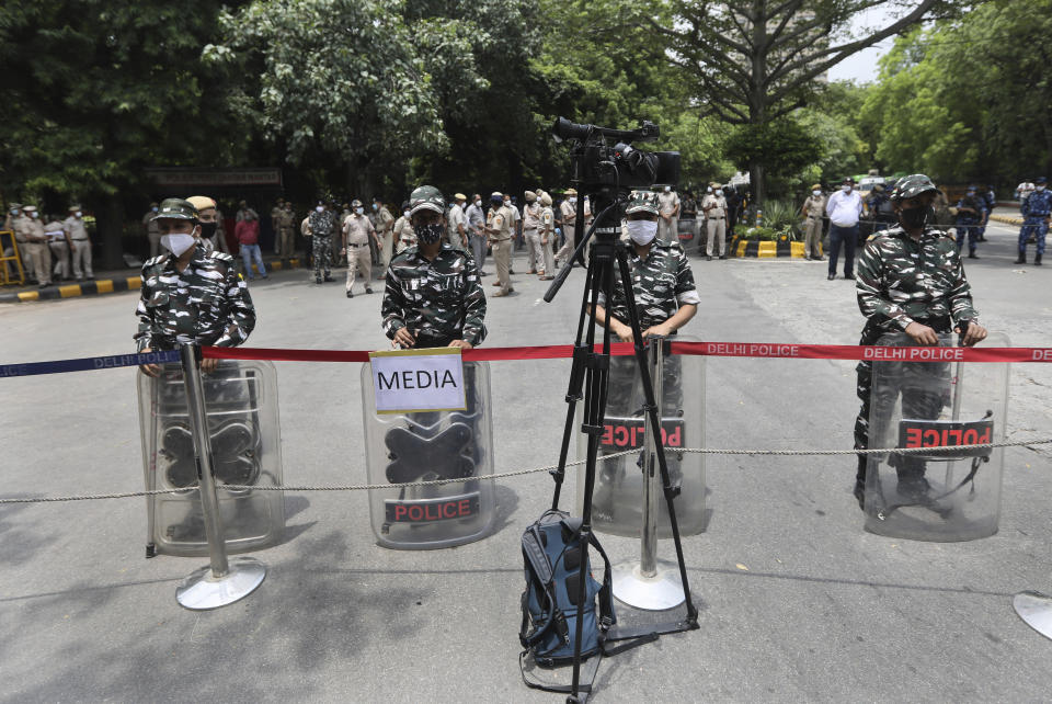 Indian policemen stand guard at farmers protest site in New Delhi, India, Thursday, July 22, 2021. More than 200 farmers on Thursday began a protest near India's Parliament to mark eight months of their agitation against new agricultural laws that they say will devastate their income. (AP Photo/Manish Swarup)