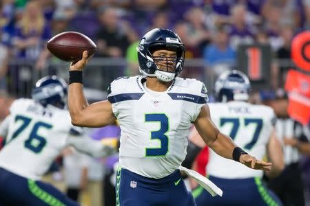Aug 24, 2018; Minneapolis, MN, USA; Seattle Seahawks quarterback Russell Wilson (3) throws in the second quarter against Minnesota Vikings at U.S. Bank Stadium. Mandatory Credit: Brad Rempel-USA TODAY Sports