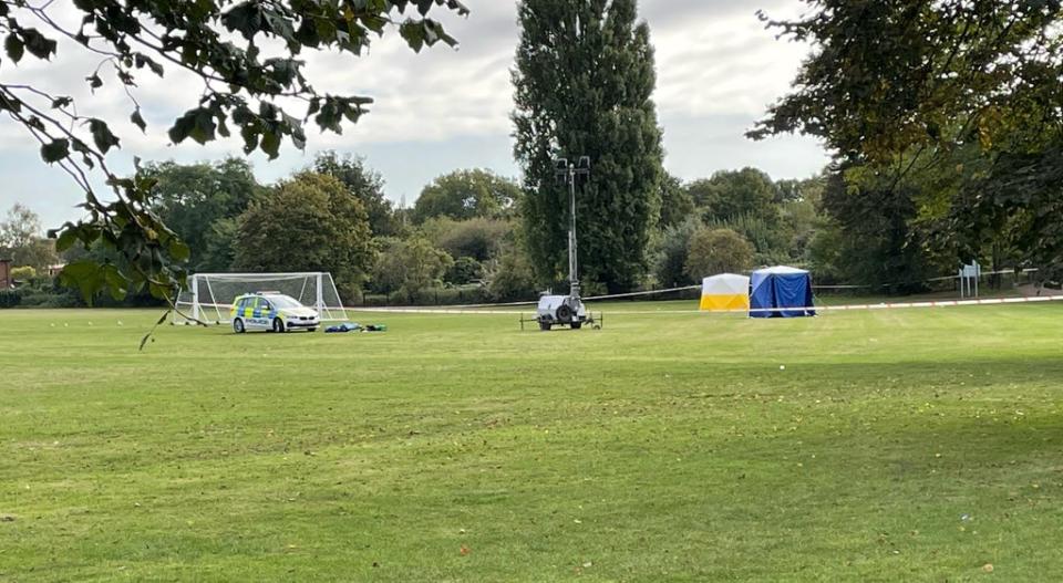 A police car and forensic tents at the scene on a playing field in Craneford Way, Twickenham, south-west London (Sophie Wingate/PA) (PA Wire)