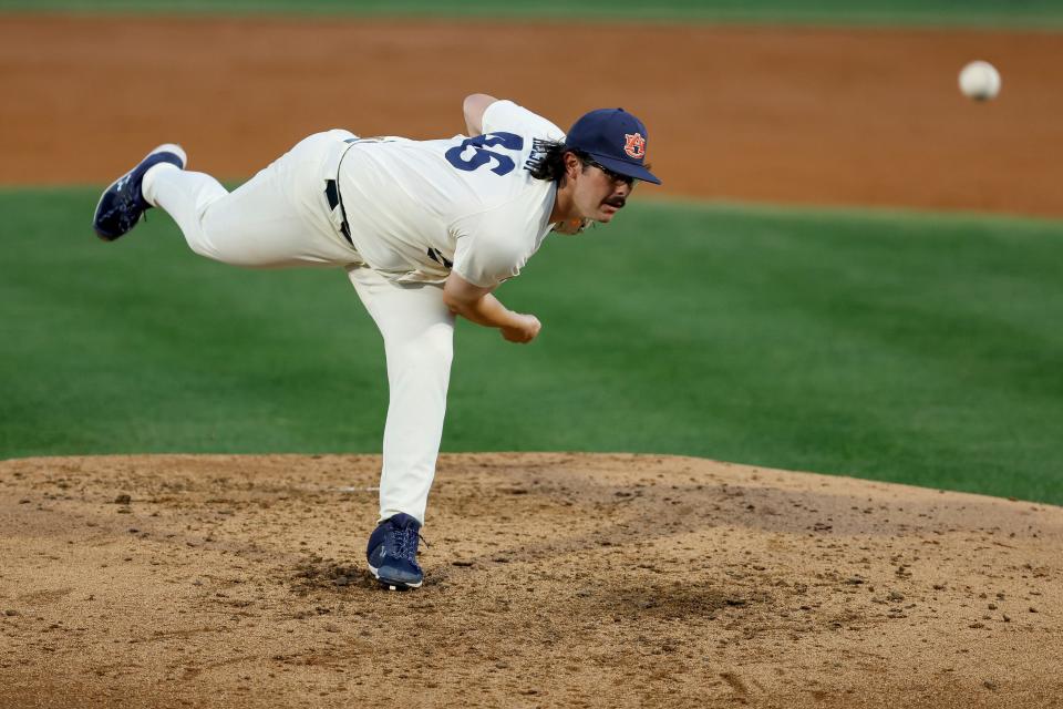 Auburn's Chase Allsup (46) delivers a pitch during an NCAA baseball game against Georgia on Friday, March 24, 2023, in Auburn, Ala. (AP Photo/Stew Milne)