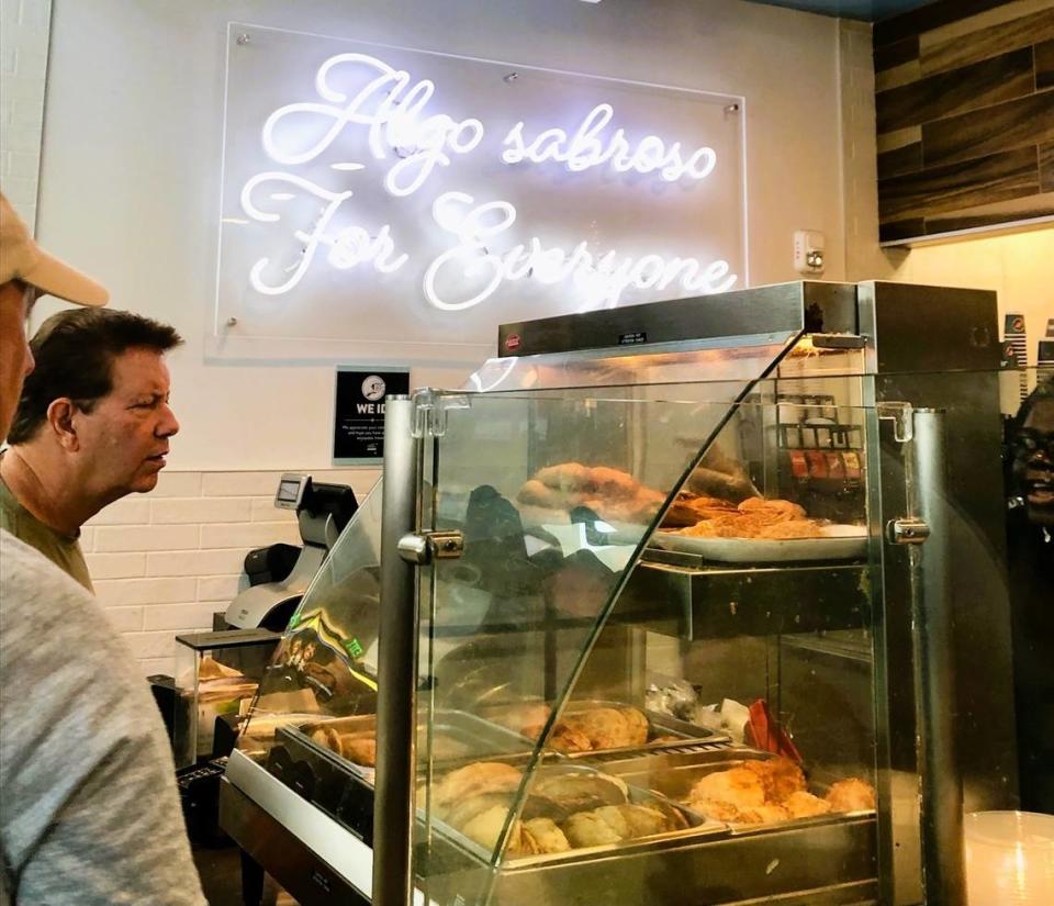 Passengers line up at the Sergio’s Cuban food counter at Florida-Hollywood International Airport.