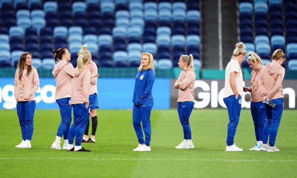 England’s manager, Sarina Wiegman (centre), on the pitch at the Sydney Football Stadium with her players