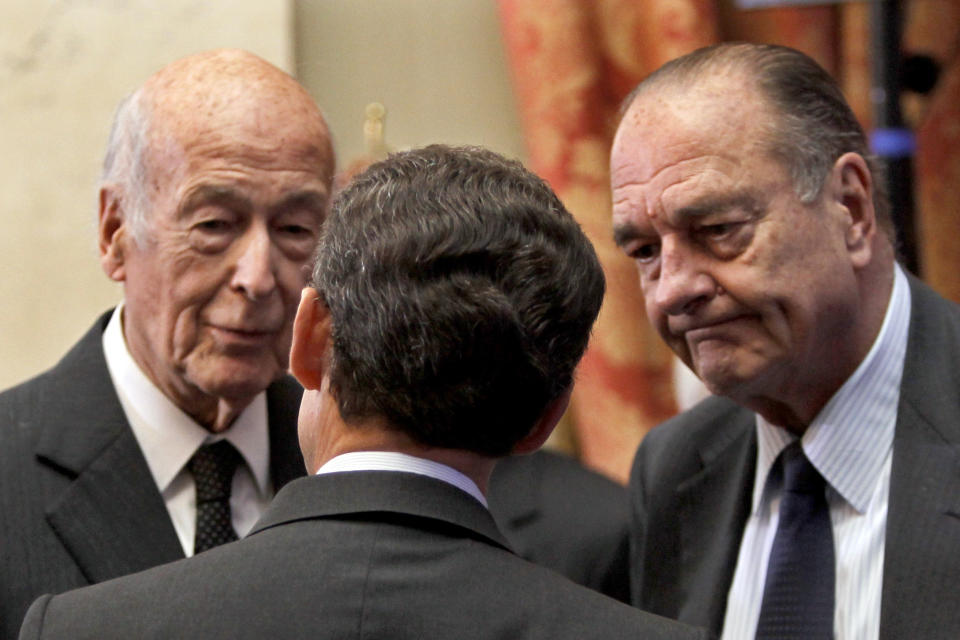 FILE - In this March 1, 2010 file photo, France's President Nicolas Sarkozy, center, speaks with former French Presidents, Jacques Chirac, right, and Valery Giscard d'Estaing, in Paris. Valery Giscard d’Estaing, the president of France from 1974 to 1981 who became a champion of European integration, has died Wednesday, Dec. 2, 2020 at the age of 94, his office and the French presidency said. (AP Photo/Charles Platiau, Pool, File)