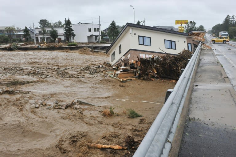 The world's nations concluded a pact in Paris to halt the march of climate change, which threatens stronger storms, longer droughts and land-gobbling sea-level rise