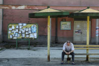 <p>Death notices are seen on a notice board as a man sits at a bus station in the village of Kalna, near the southeastern town of Knjazevac, Serbia, Aug. 15, 2017. (Photo: Marko Djurica/Reuters) </p>