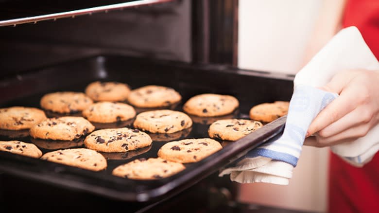 taking cookies out of oven