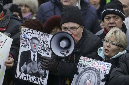 A pro-government supporter shouts slogans in front of the presidential office in Bucharest, Romania, February 6, 2017. Inquam Photos/Octav Ganea/via REUTERS