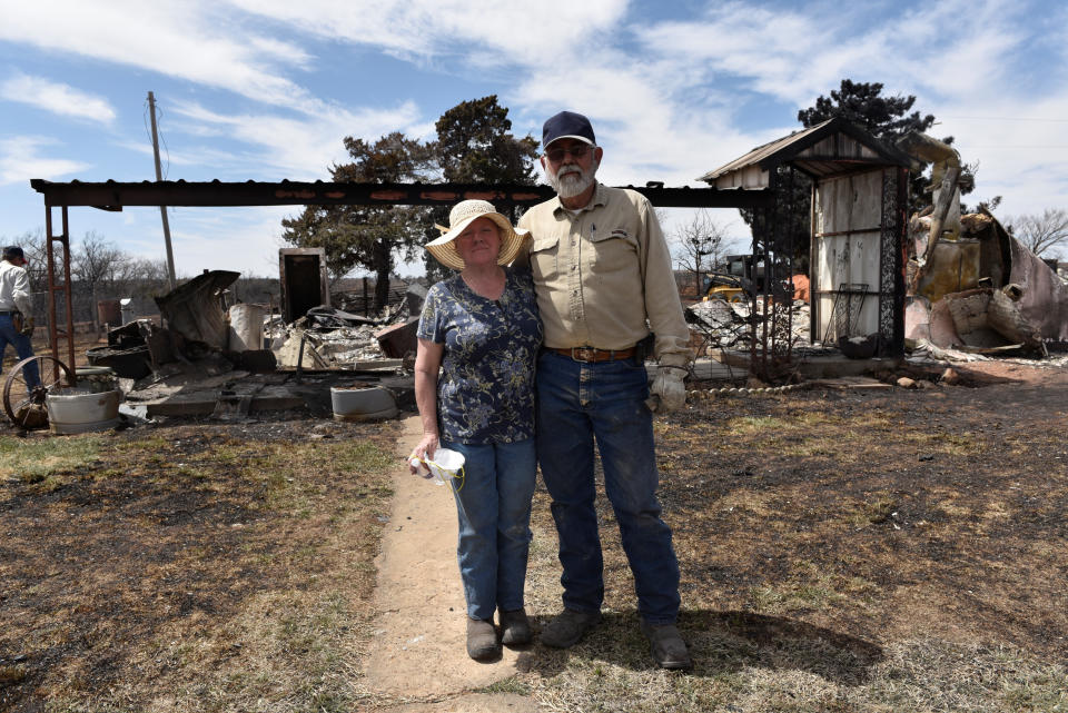 Arlinda and Larry Lynes stand in front of what remains of their home that was destroyed by the Rhea Fire near Taloga, Oklahoma, on. April 17. (Photo: Nick Oxford / Reuters)