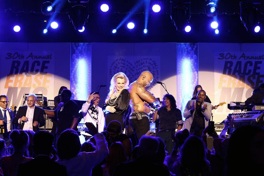 (Left to Right) Race to Erase MS Founder Nancy Davis and Flo Rida get the party going during the 30th Annual Race to Erase MS Gala at the Fairmont Century Plaza in Century City. (Tommaso Boddi/Getty Images for Race to Erase MS)