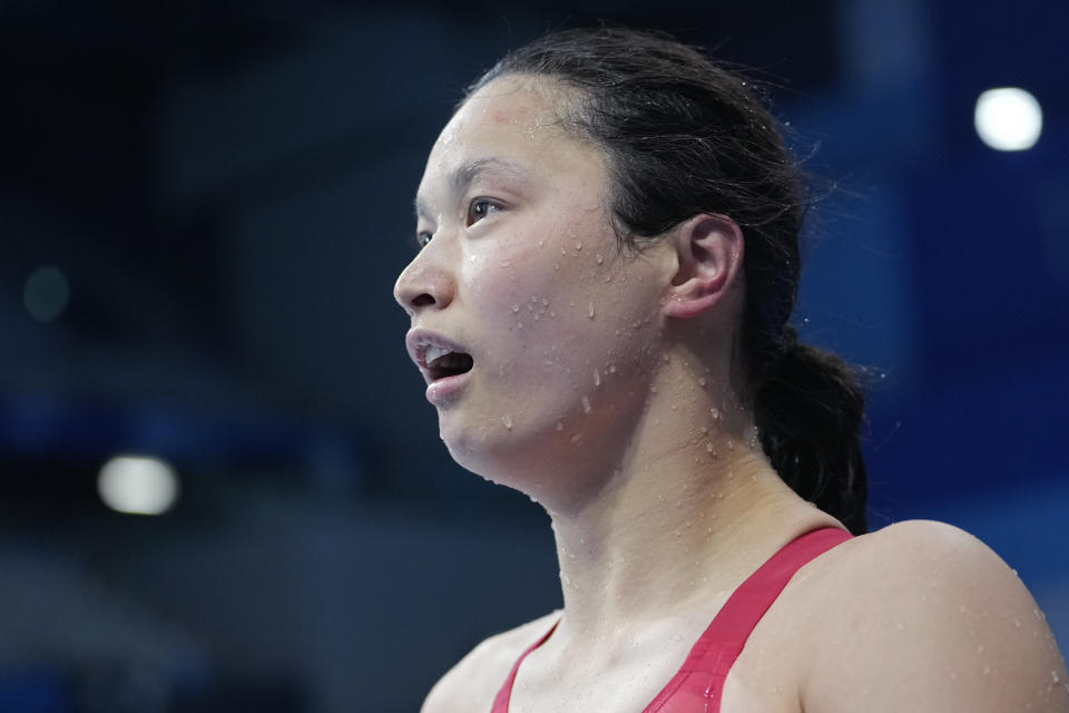 Margaret MacNeil of Canada leaves the pool after winning the final of the women's 100-meter butterfly at the 2020 Summer Olympics, Monday, July 26, 2021, in Tokyo, Japan. (AP Photo/Martin Meissner)