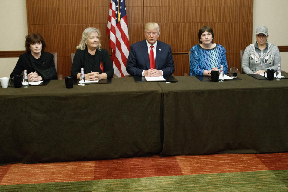 FILE - In this Oct. 9, 2016, file photo Republican presidential candidate Donald Trump, center, sits with, from right, Paula Jones, Kathy Shelton, Juanita Broaddrick, and Kathleen Willey, before the second presidential debate with democratic presidential candidate Hillary Clinton at Washington University in St. Louis. Trump called a surprise news conference hours ahead of the debate against Hillary Clinton, and reporters walked in to find Trump sitting at a table alongside three women who had accused Clinton's husband, former President Bill Clinton, of unwanted sexual advances decades earlier. (AP Photo/ Evan Vucci, File)