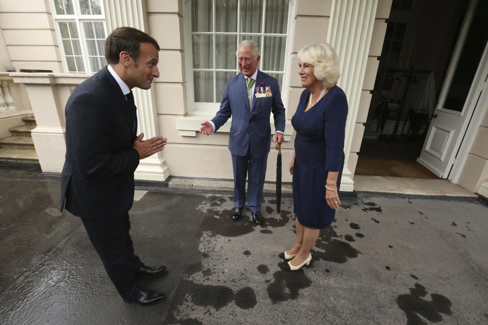 Britain's Prince Charles and Camilla, Duchess of Cornwall welcome French president Emmanuel Macron to Clarence House in London, Thursday June 18, 2020. The French president is traveling to London to mark the day that De Gaulle delivered his defiant broadcast 80 years ago urging his nation to fight on despite the fall of France. In a reflection of the importance of the event, the trip marks Macron’s first international trip since France's lockdown amid the COVID-19 pandemic. (Jonathan Brady/Pool via AP)