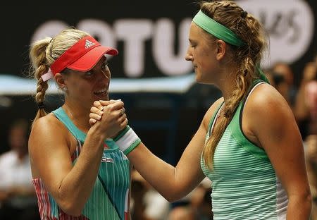 Germany's Angelique Kerber (L) shakes hands with Belarus' Victoria Azarenka after Kerber won their quarter-final match at the Australian Open tennis tournament at Melbourne Park, Australia, January 27, 2016. REUTERS/Tyrone Siu