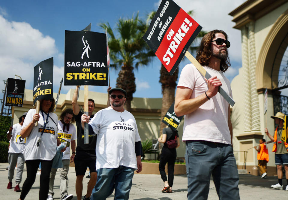 Striking members of WGA and SAG-AFTRA picket (Mario Tama / Getty Images file)