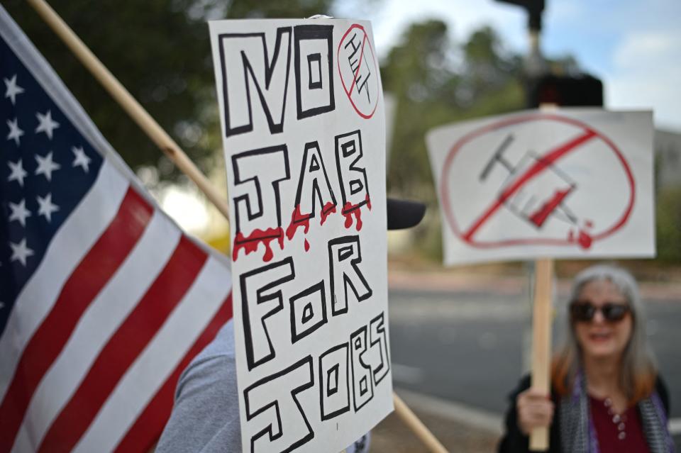 Workers at NASA's Jet Propulsion Laboratory (JPL) and their supporters protest November 1, 2021 outside JPL in Pasadena, California against a US government mandate requiring all federal employees to received the Covid-19 coronavirus vaccine. - Eleven US states with Republican governors sued the Biden administration on October 29, 2021 seeking to block a Covid-19 vaccine mandate for federal contractors, arguing it is unconstitutional and violates federal procurement law. (Photo by Robyn Beck / AFP) (Photo by ROBYN BECK/AFP via Getty Images)