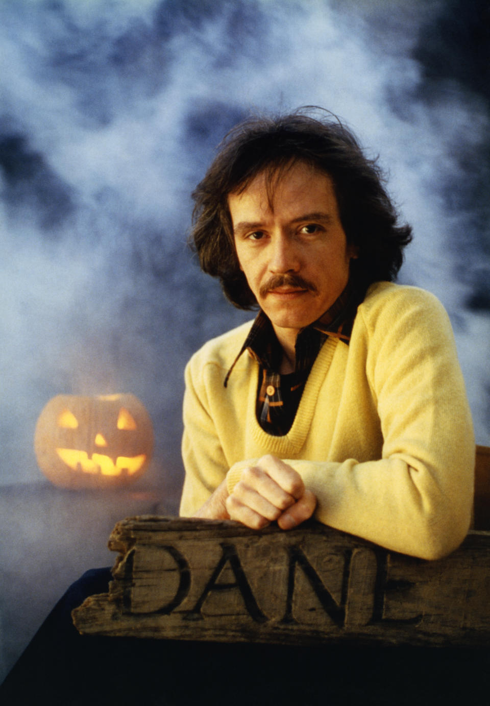 John Carpenter poses for a photo on the set of his movie 