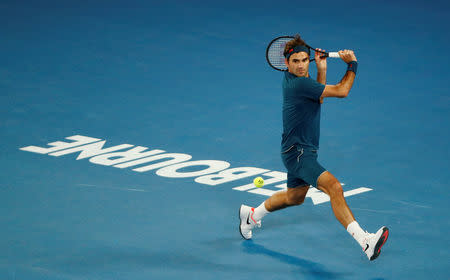 FILE PHOTO: Tennis - Australian Open - Fourth Round - Melbourne Park, Melbourne, Australia, January 20, 2019. Switzerland’s Roger Federer in action during the match against Greece’s Stefanos Tsitsipas. REUTERS/Edgar Su/File Photo