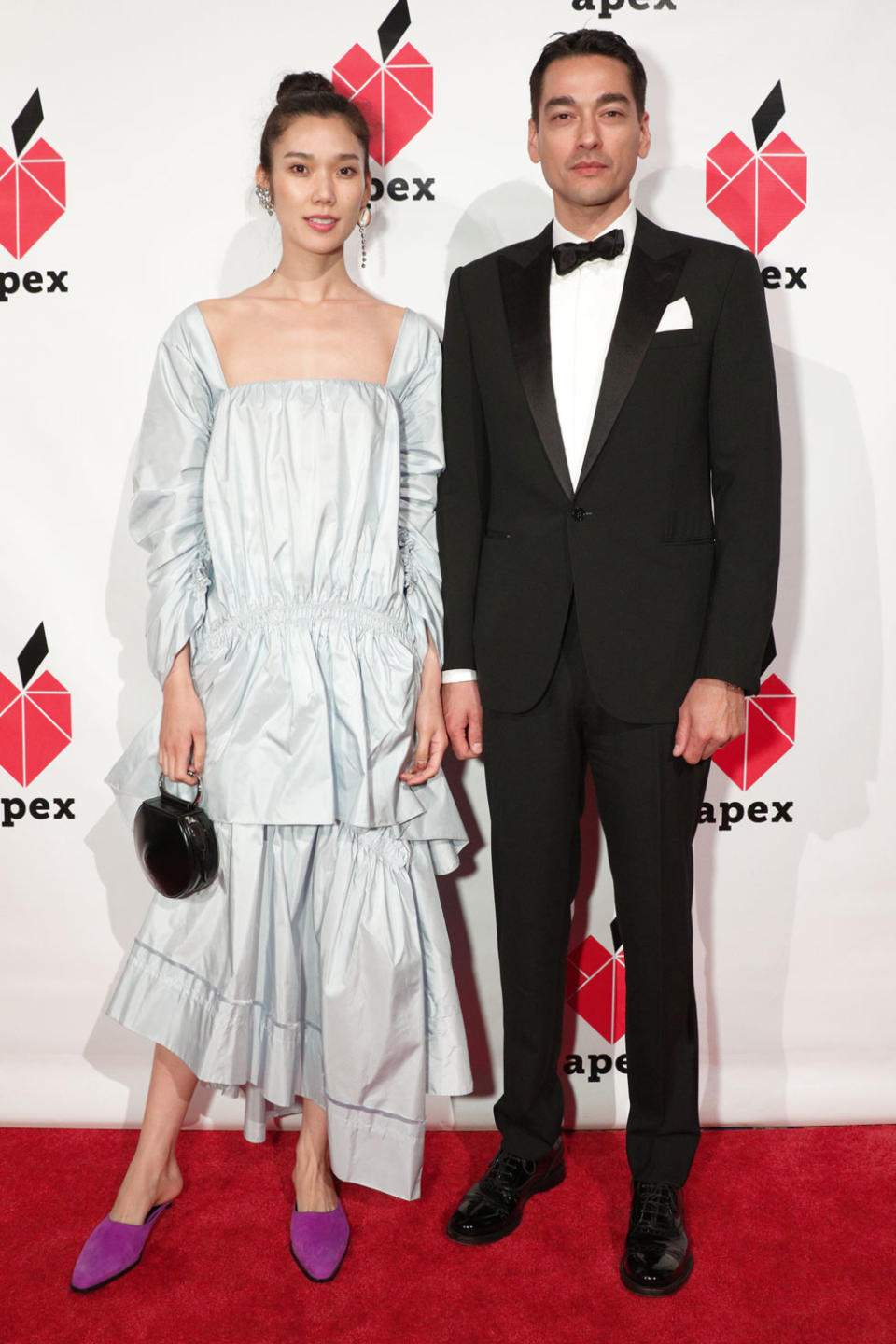 <p>Japanese actress and model Tao Akamoto wore an open-neck baby-blue dress with purple mules as she stood beside Tenzen Wild, founder of <em>The Last Magazine</em>, at the 26th annual Apex for Youth gala. (Photo: BFA/Courtesy of Apex for Youth) </p>