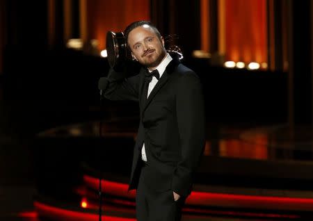 Aaron Paul accepts the award for Outstanding Supporting Actor In A Drama Series for "Breaking Bad" during the 66th Primetime Emmy Awards in Los Angeles, California August 25, 2014. REUTERS/Mario Anzuoni